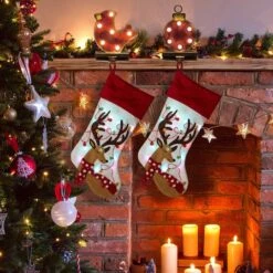 Glitzhome® 21" LED Reindeer Christmas Stockings, 2ct. -Michaels X-Mas Decor D252853S 2