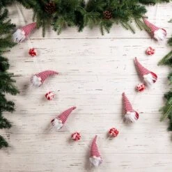 Glitzhome® 6ft. Red & White Fabric Christmas Gnome Garland, 2ct. 13 Glitzhome® 6ft. Red & White Fabric Christmas Gnome Garland, 2ct. -Michaels X-Mas Decor D445245S 2