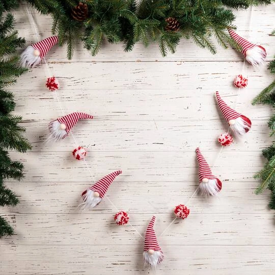 Glitzhome® 6ft. Red & White Fabric Christmas Gnome Garland, 2ct. 5 Glitzhome® 6ft. Red & White Fabric Christmas Gnome Garland, 2ct. - Image 3