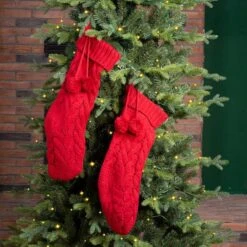 Glitzhome® 24" Red Knitted Polyester Christmas Stocking With Pom Pom, 2ct. 13 Glitzhome® 24" Red Knitted Polyester Christmas Stocking With Pom Pom, 2ct. -Michaels X-Mas Decor D479603S 3