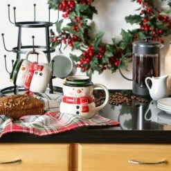 DII® 12oz. Cheerful Snowman Ceramic Mugs, 2ct. 12 DII® 12oz. Cheerful Snowman Ceramic Mugs, 2ct. -Michaels X-Mas Decor D539854S 4