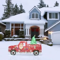 27'' Pre-Lit Santa In Red Truck Decoration 12 27'' Pre-Lit Santa In Red Truck Decoration -Michaels X-Mas Decor D619776S 12
