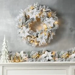 Glitzhome® 24" Pre-Lit Snow Flocked Greenery Pine Poinsettia Christmas Wreath & Matched 2 Pack 9ft. Garland Set -Michaels X-Mas Decor D652258S 3